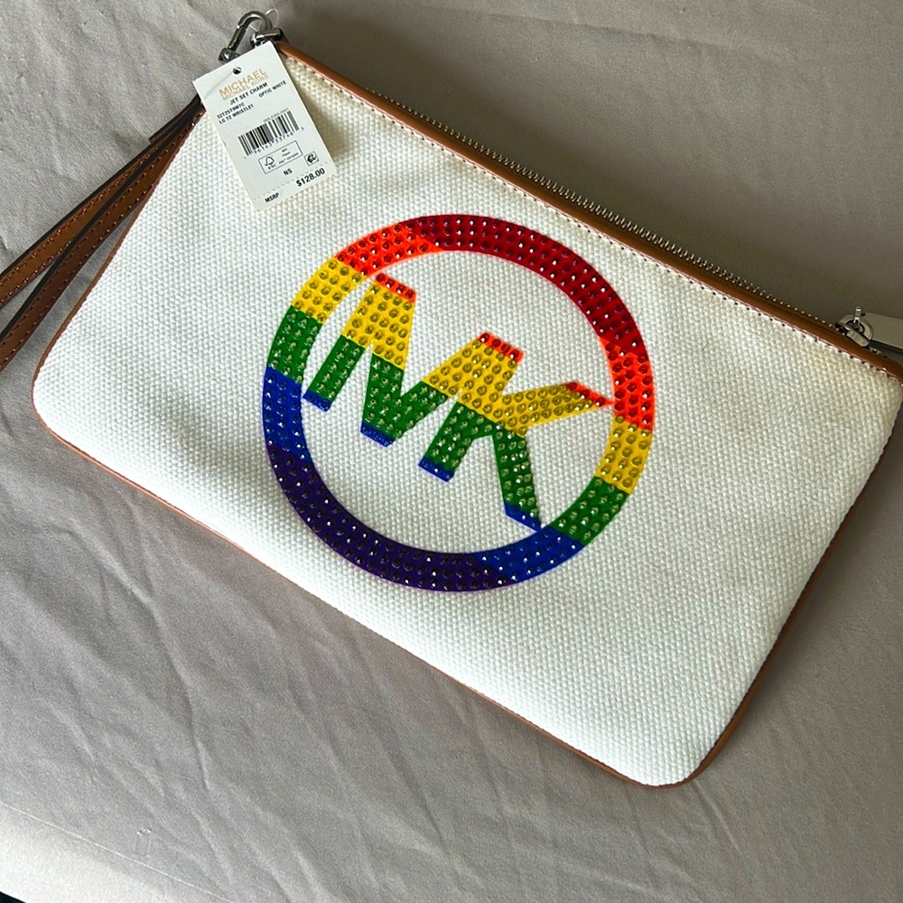 New Michael Kors wristlet wallet. White with multicolored MK logo & brown trim.